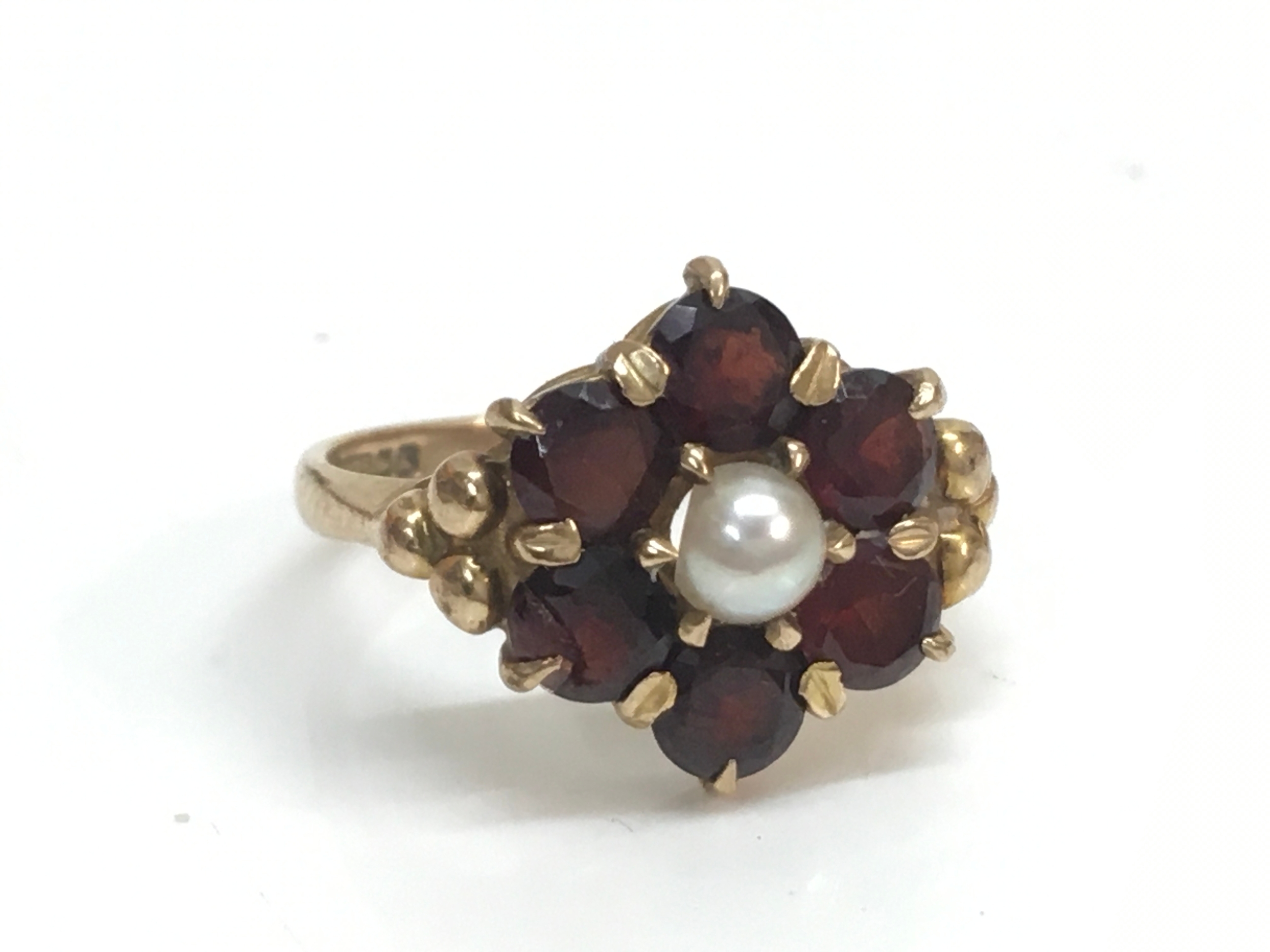 A 9ct gold garnet and pearl cluster ring , size J