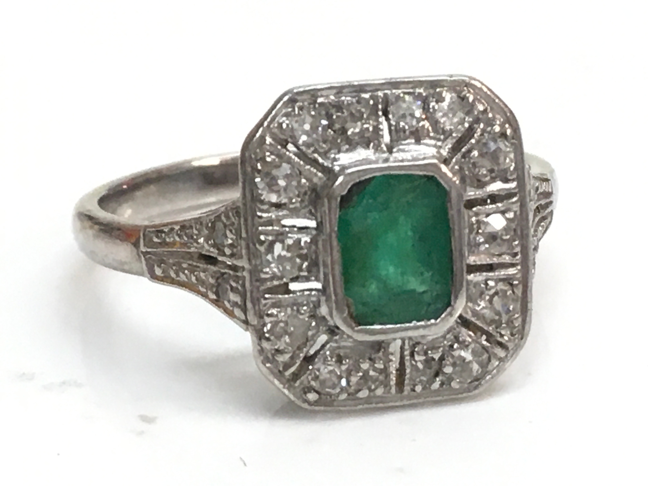 A 1930s 18ct platinum emerald and diamond set ring , size O, 3.9g total weight 