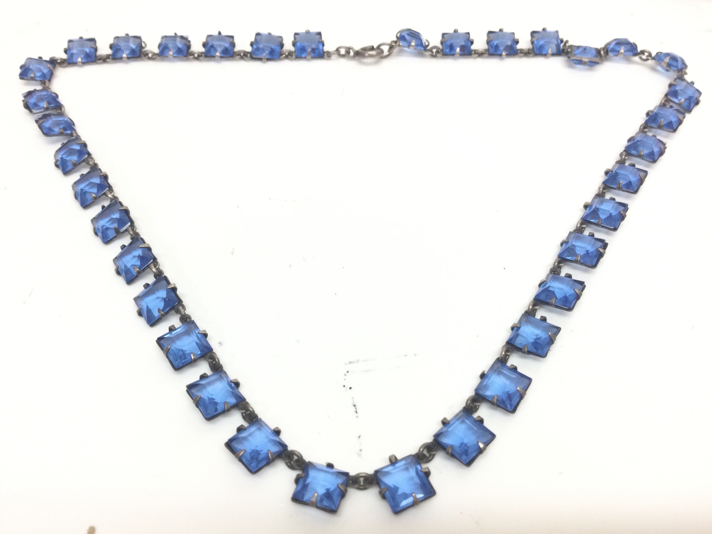 An Edwardian children's necklace , low grade silver. 10.7g total weight. 18cm long