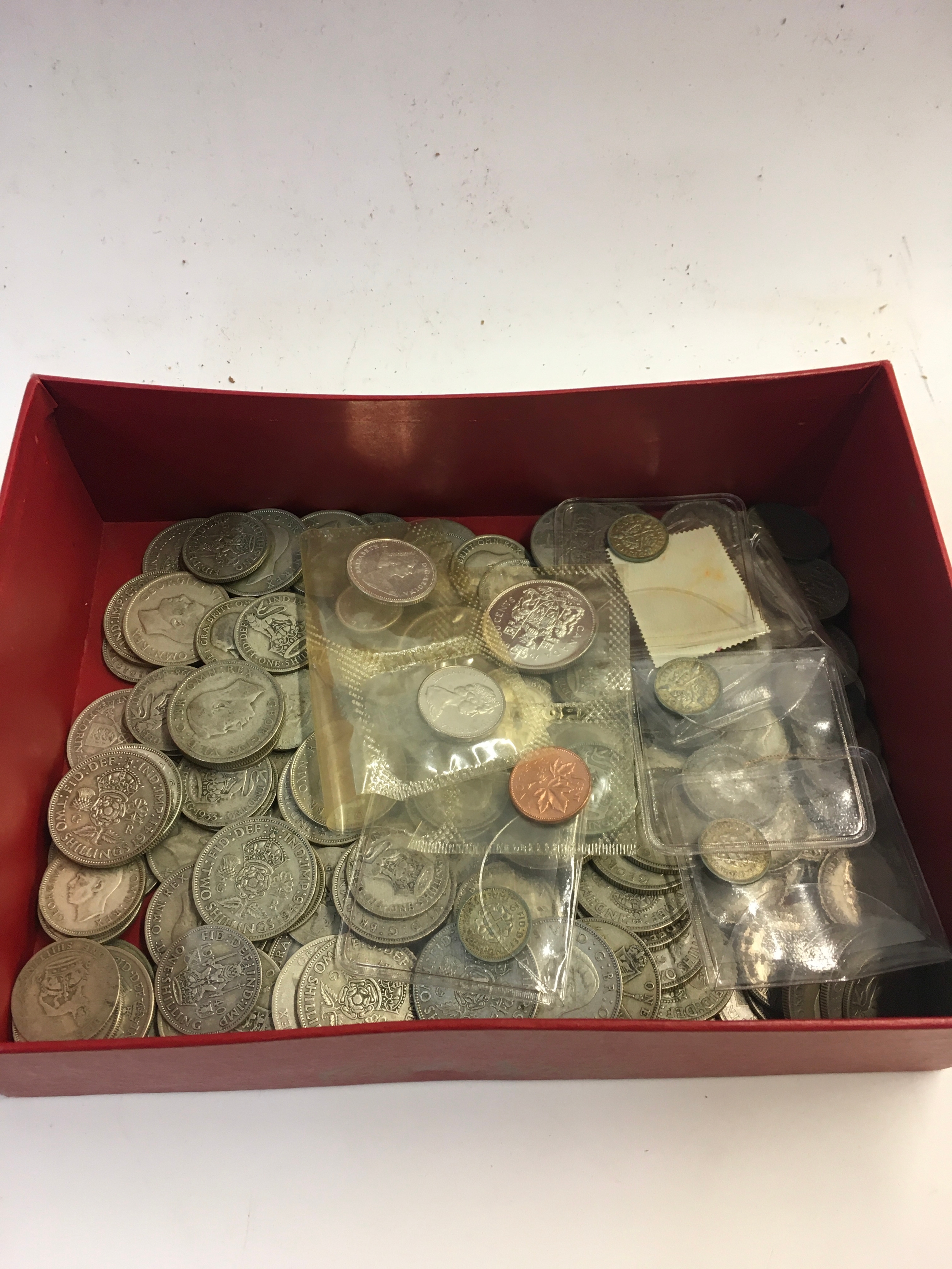 A collection of half silver coins weighing 1.5kg. 