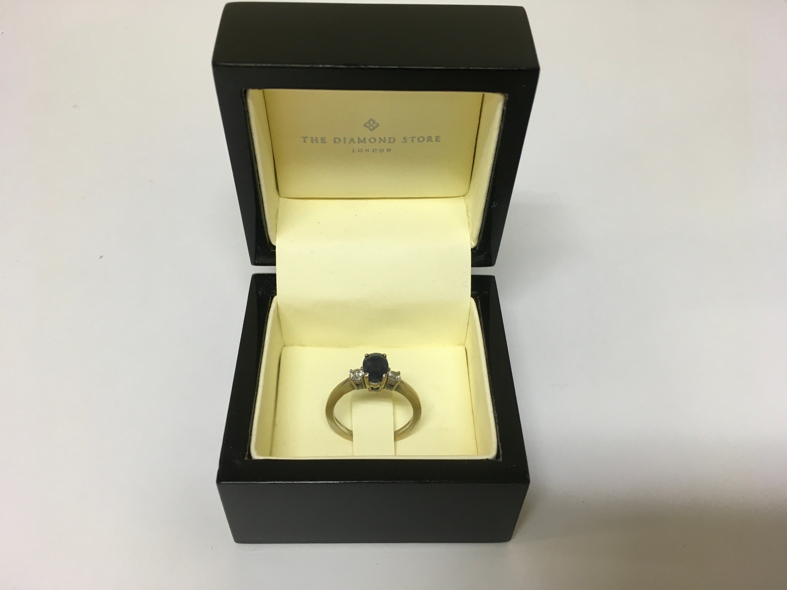 18 carat White Gold Sapphire and Diamond. Includes The Diamond Store London box. Size L.
