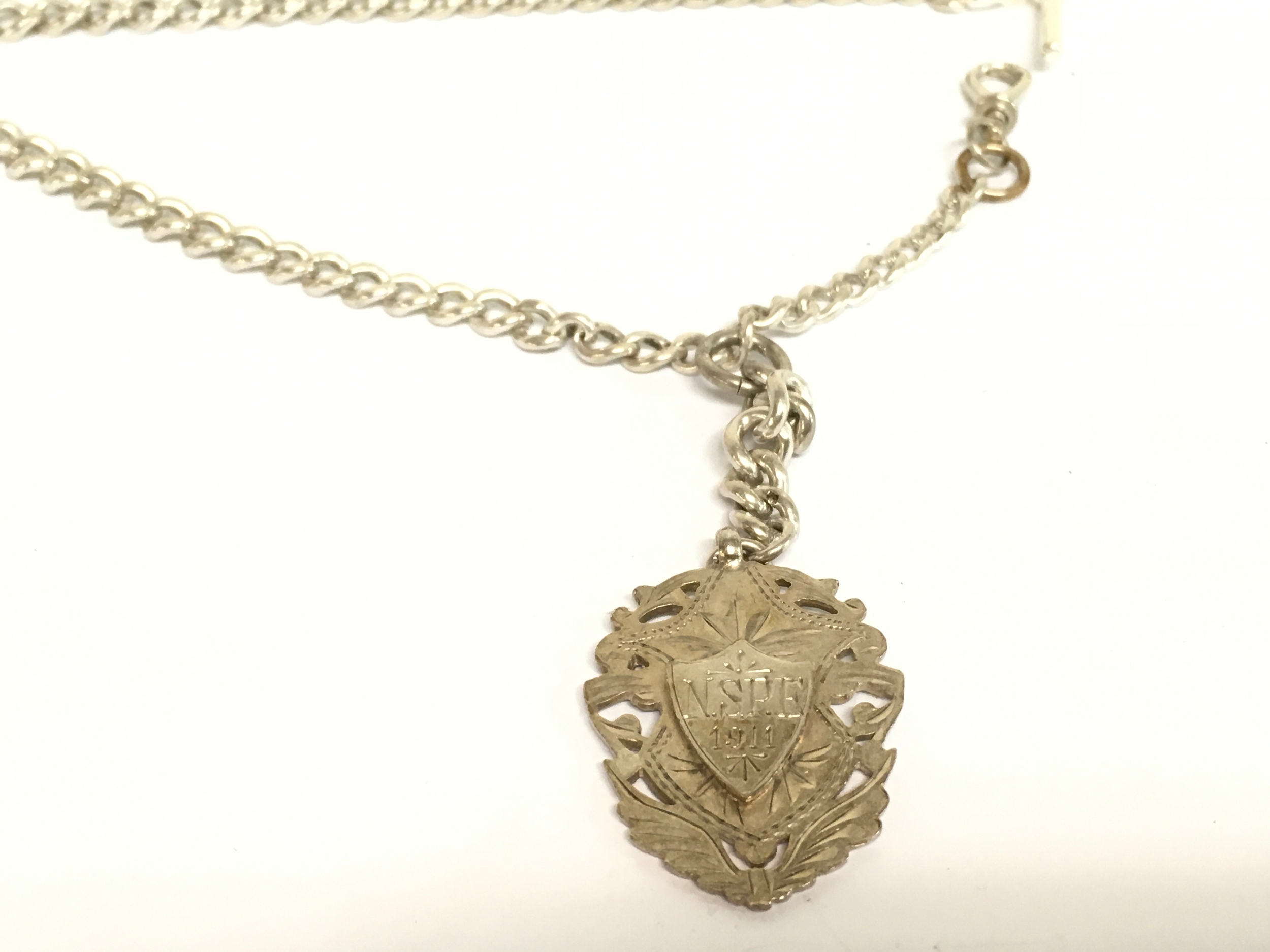 A silver Albert chain with fob. 37g