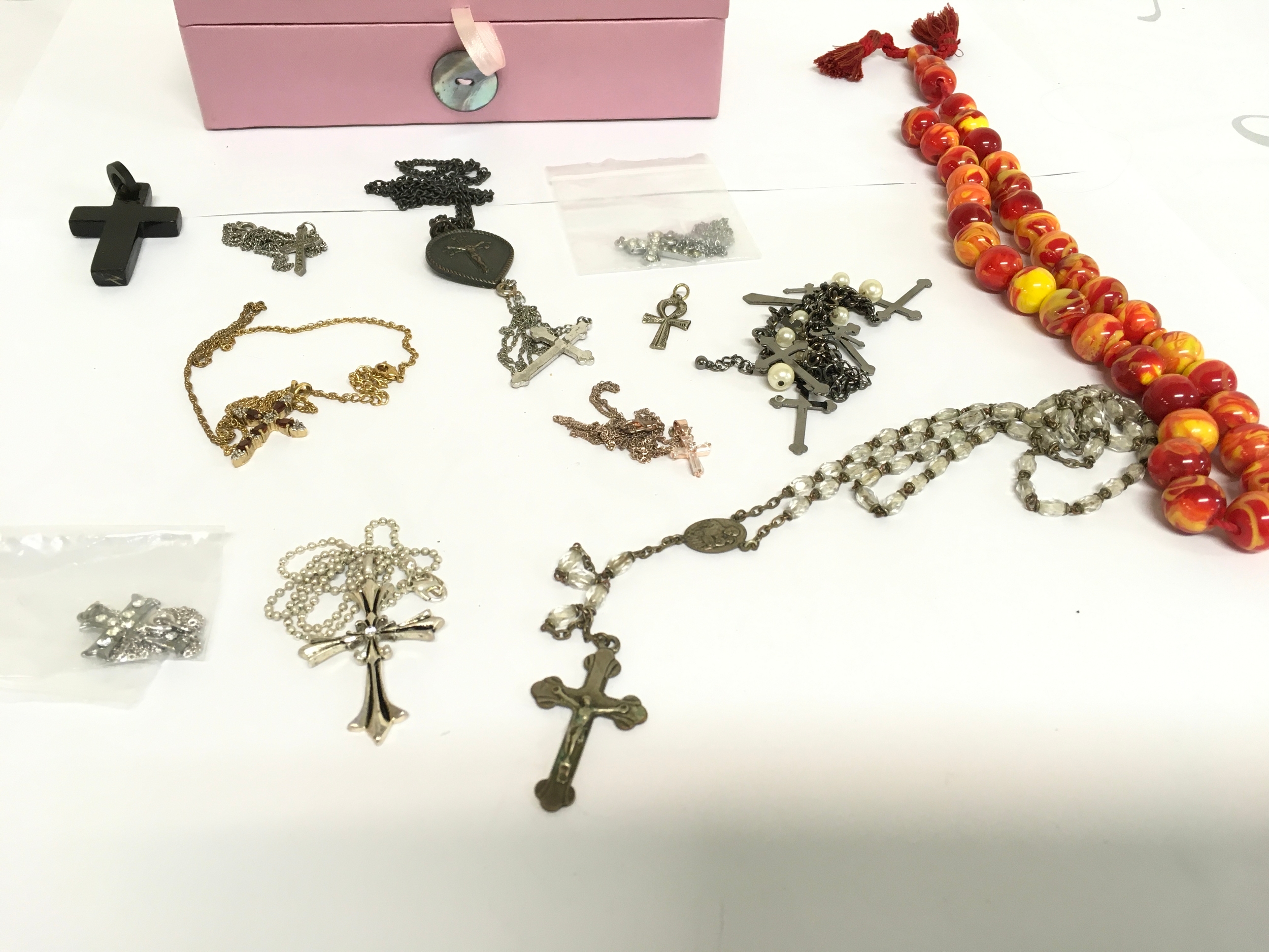 A number of crosses, chains and beads of various designs.