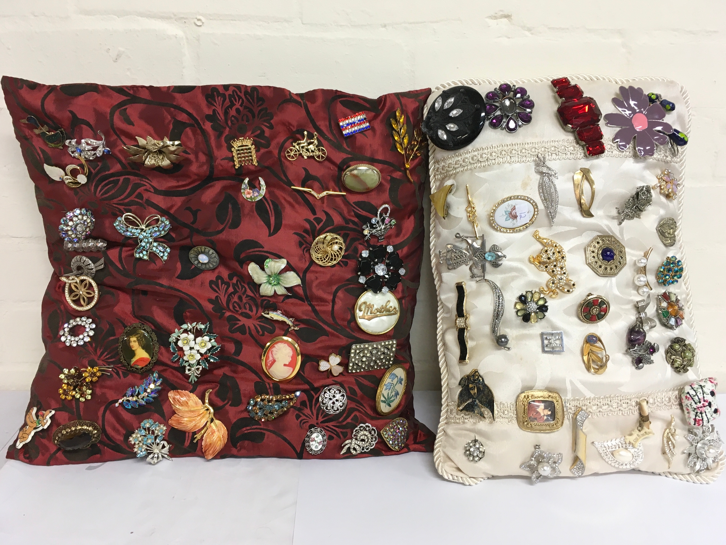 approximately 80 brooches of various designs.