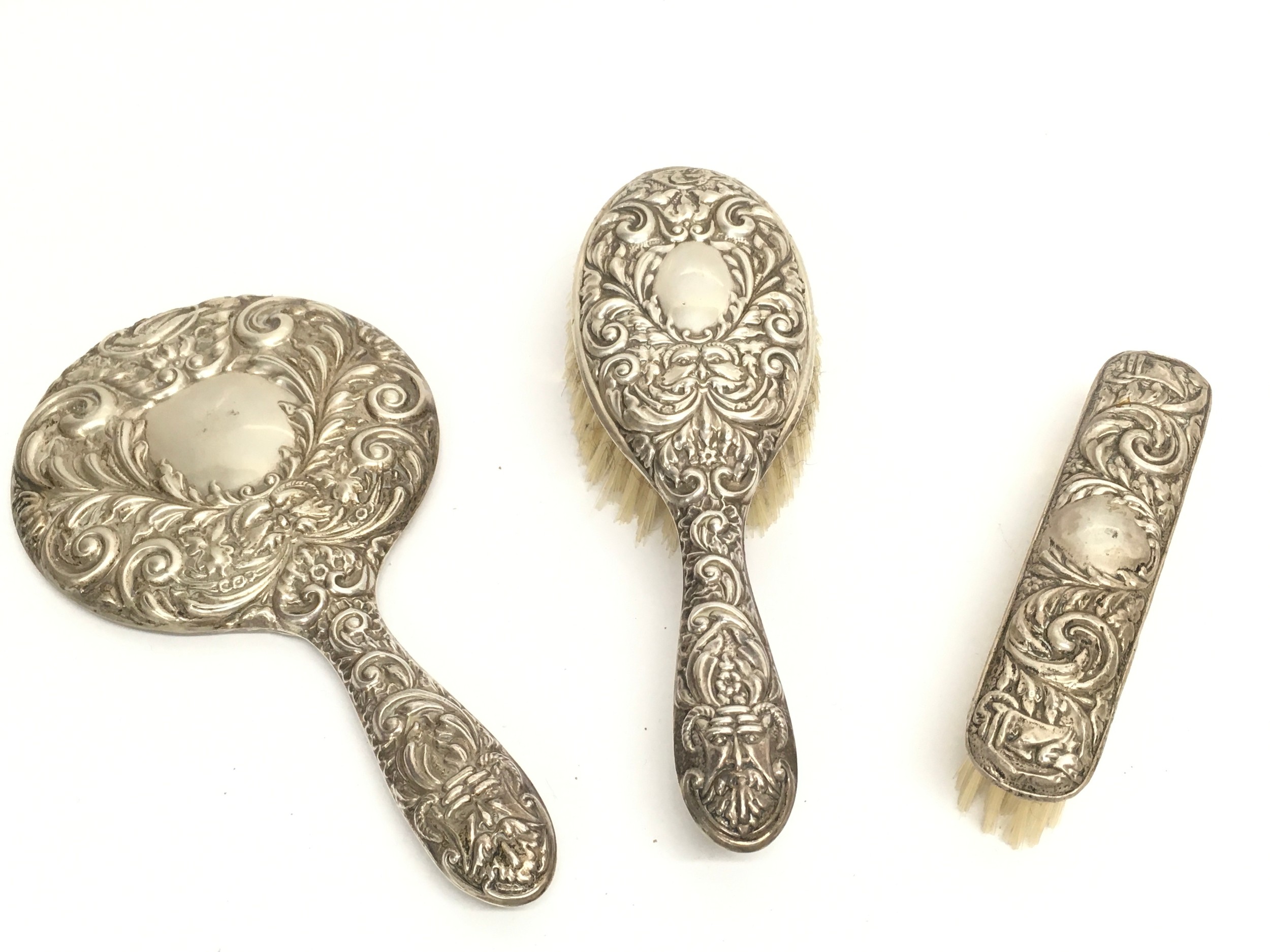 A silver dressing table set (3). 555g total weight