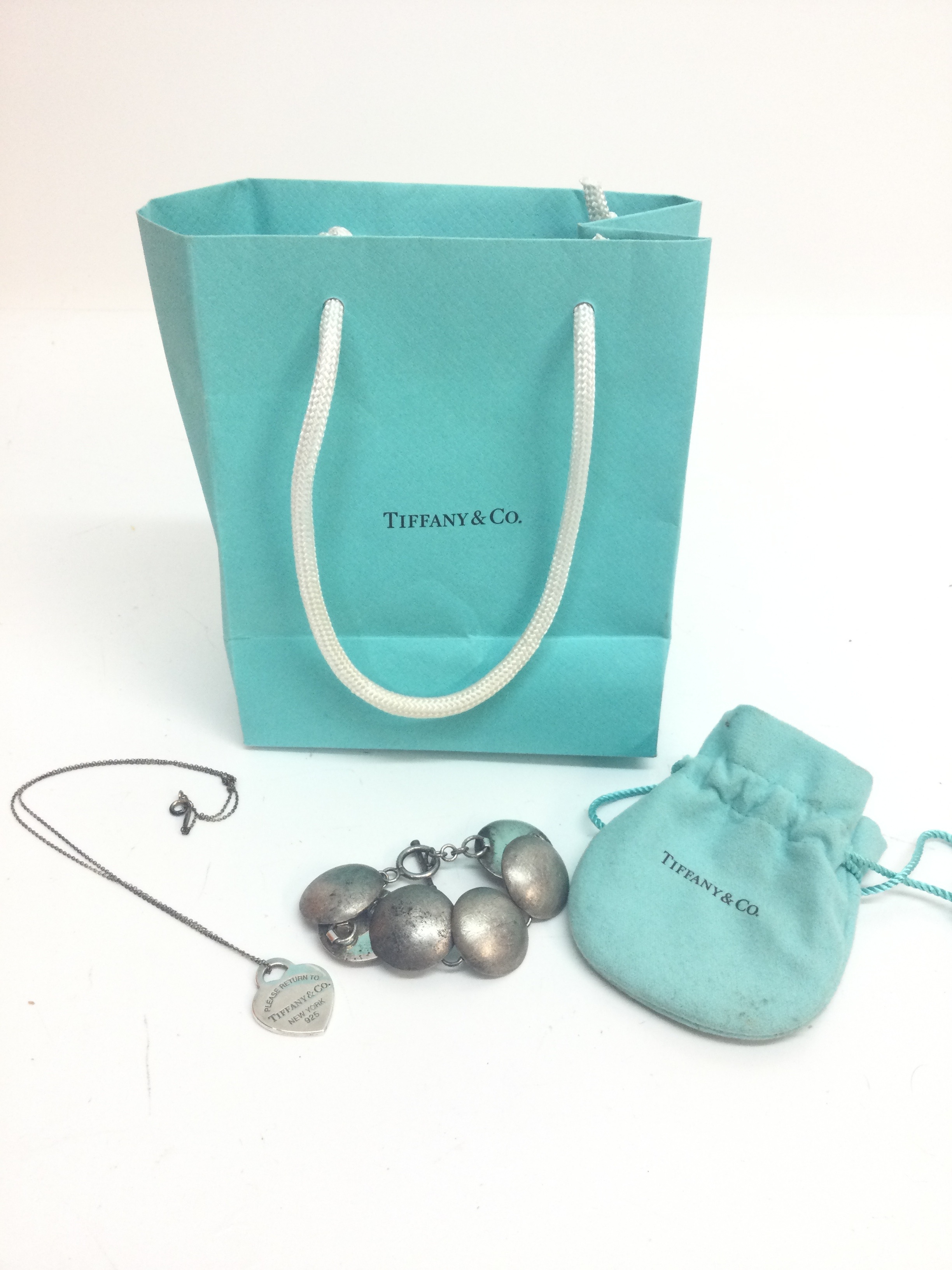 A Tiffany silver heart necklace and a silver bracelet, 29.8g total weight 