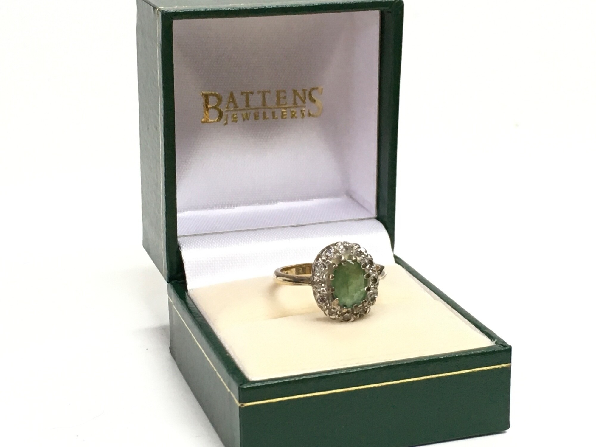 An emerald ring , size O. 4g total weight