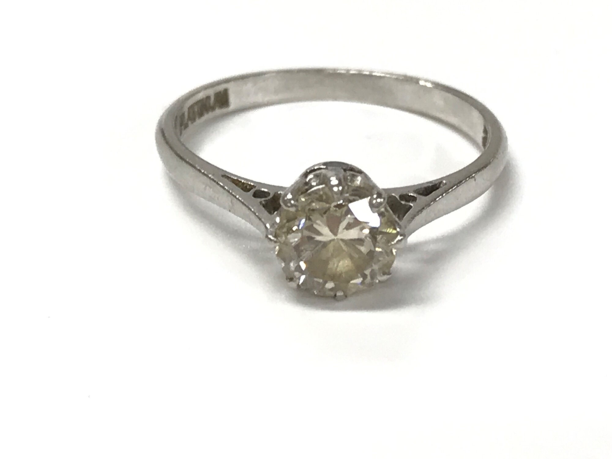 A platinum diamond solitaire ring. Size N 1/2 and 2.97g approximately 0.90ct.