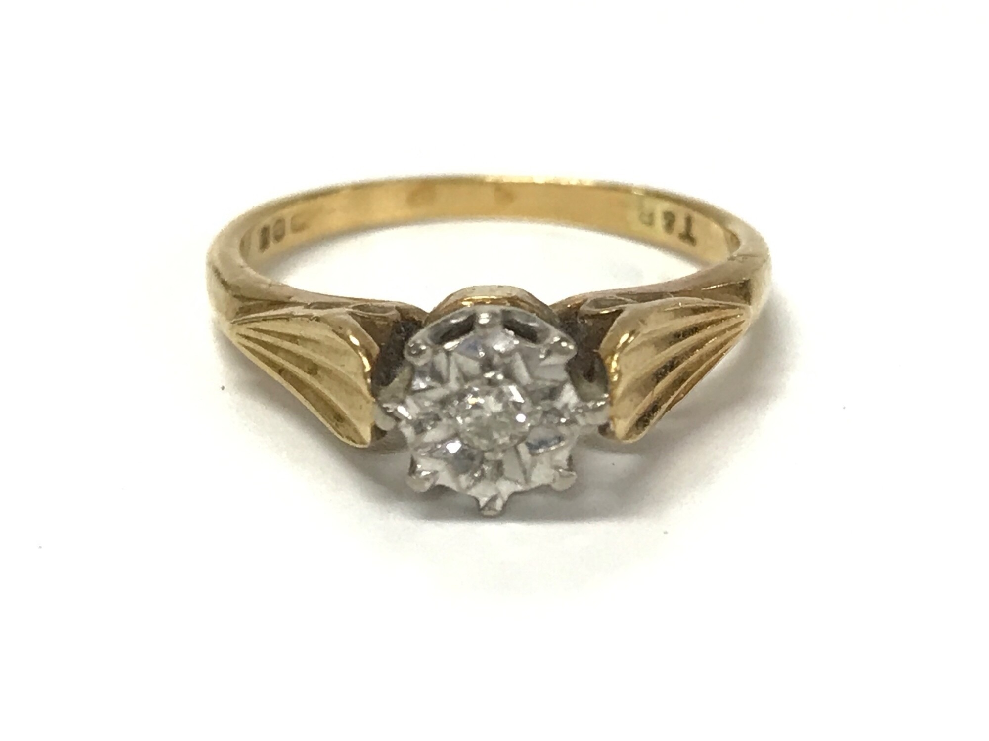 An 18ct gold diamond solitaire ring. Size M and 3.62g.