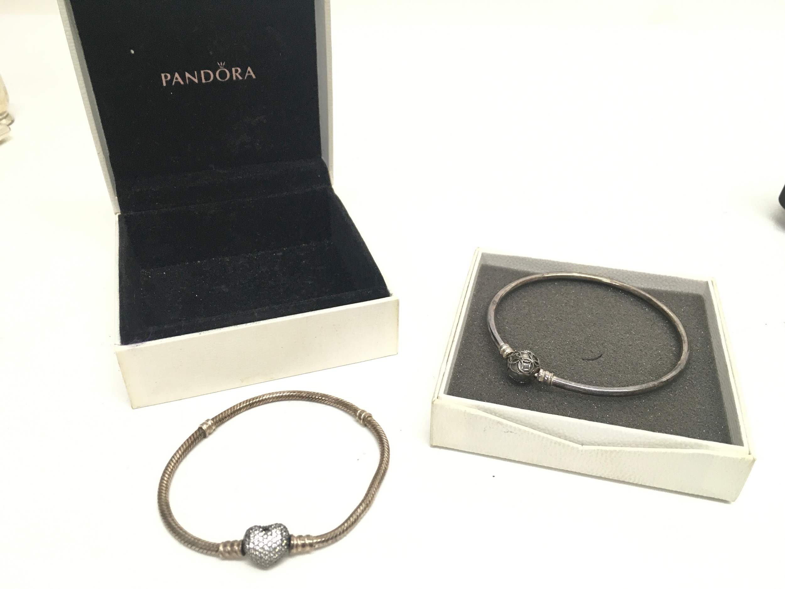Two boxed pandora bracelets