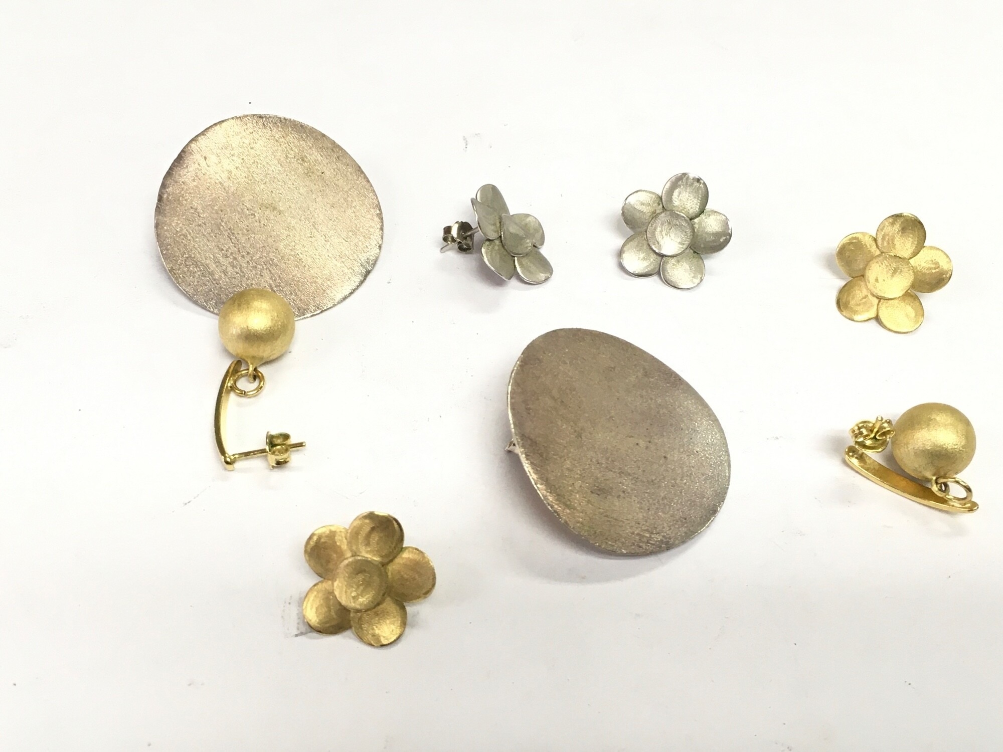 Three pairs of silver/white metal earrings including Helo examples. NO RESERVE