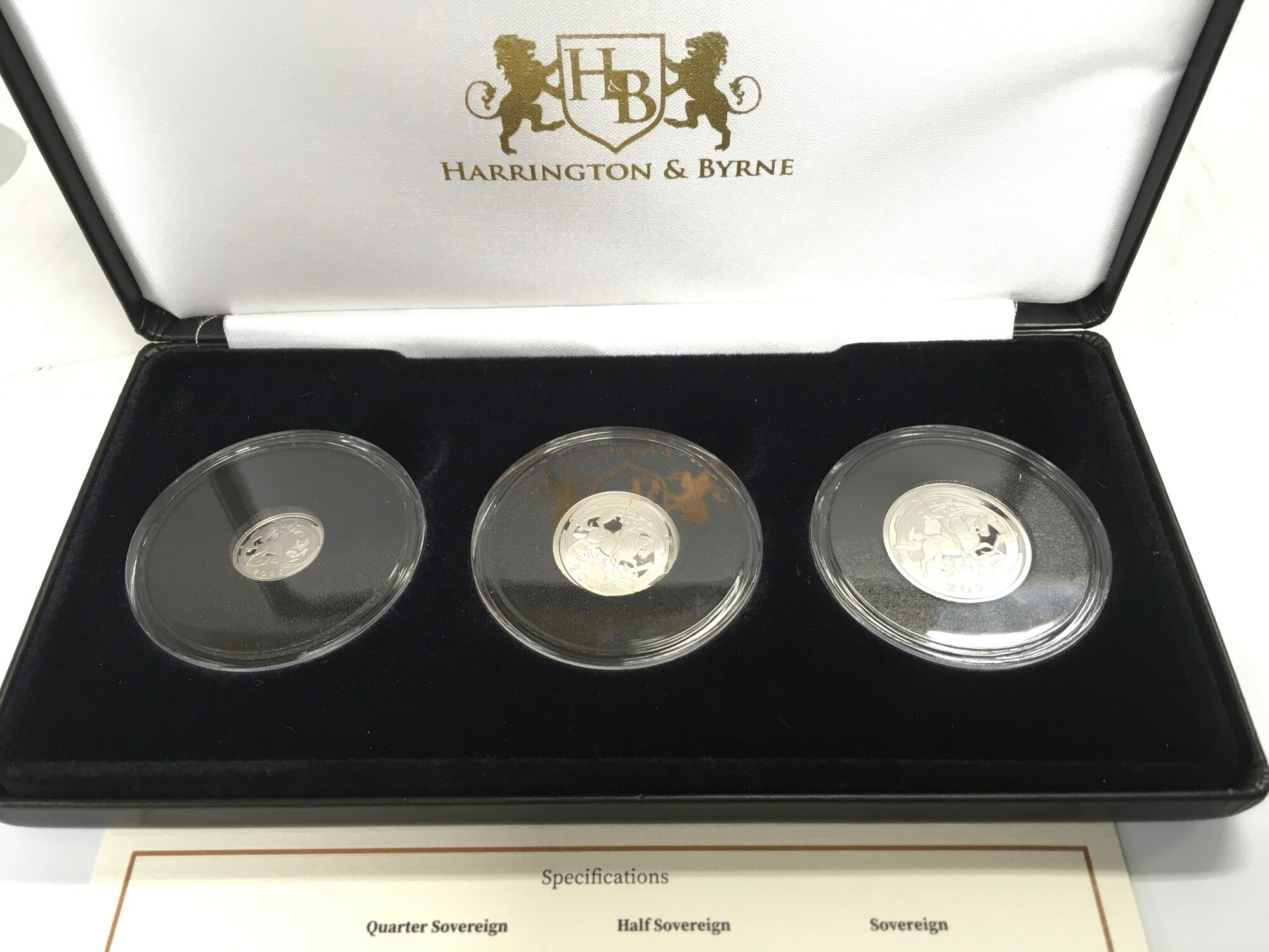 A 2025 platinum three coin set including full half and quarter Sovereign.