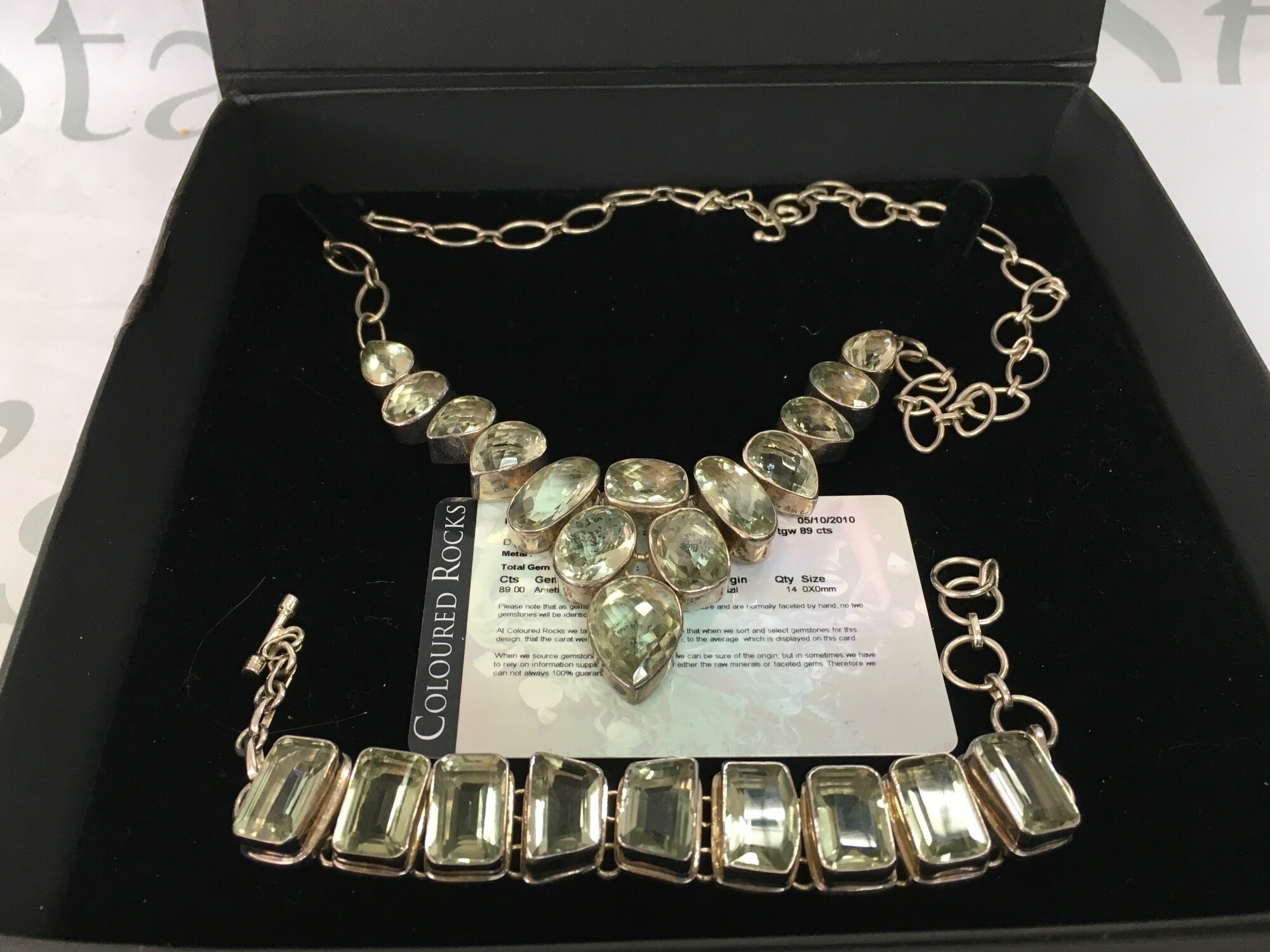 A sterling silver green amethyst necklace and bracelet