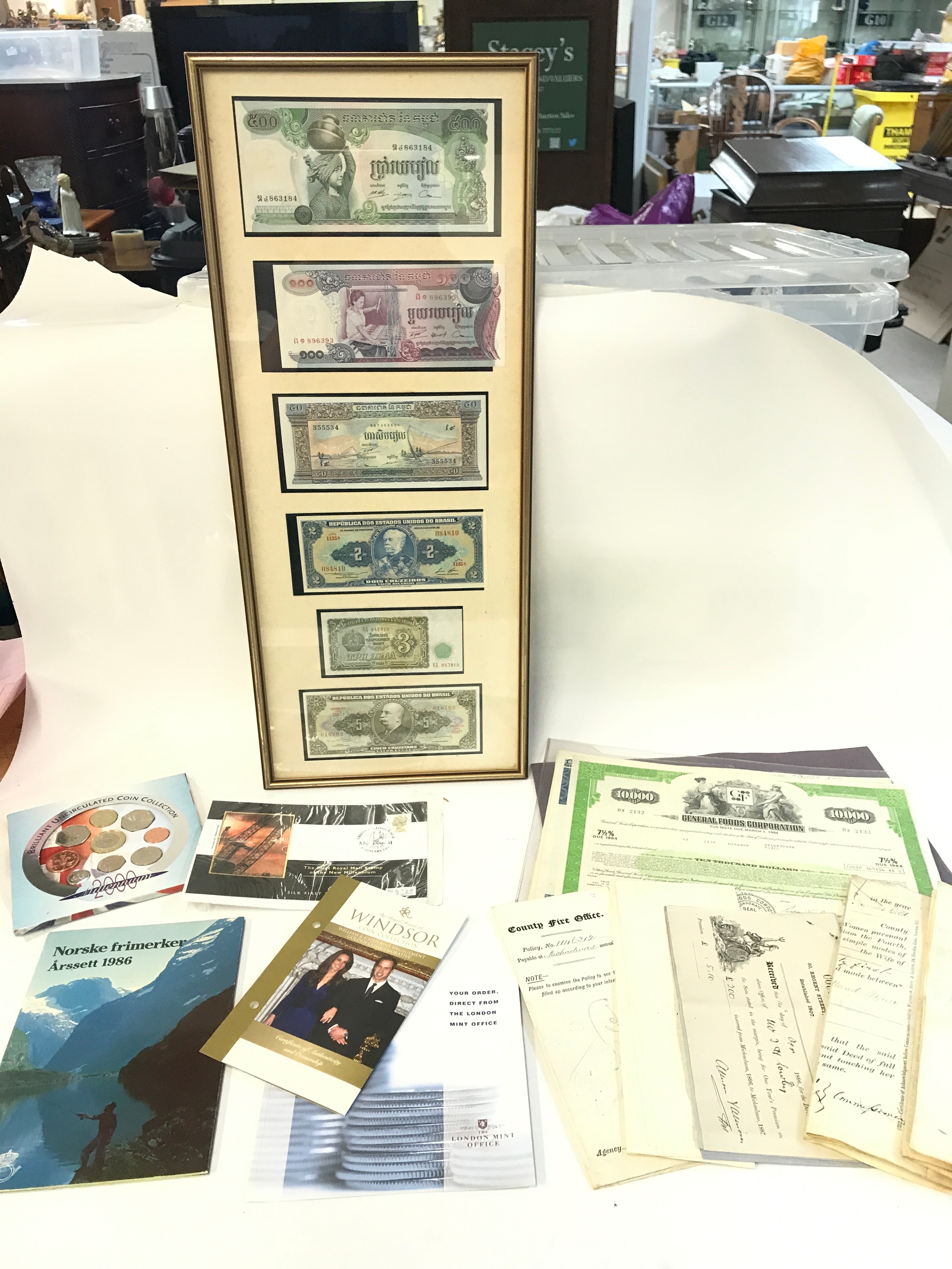 Framed bank notes , coins and bonds. No reserve