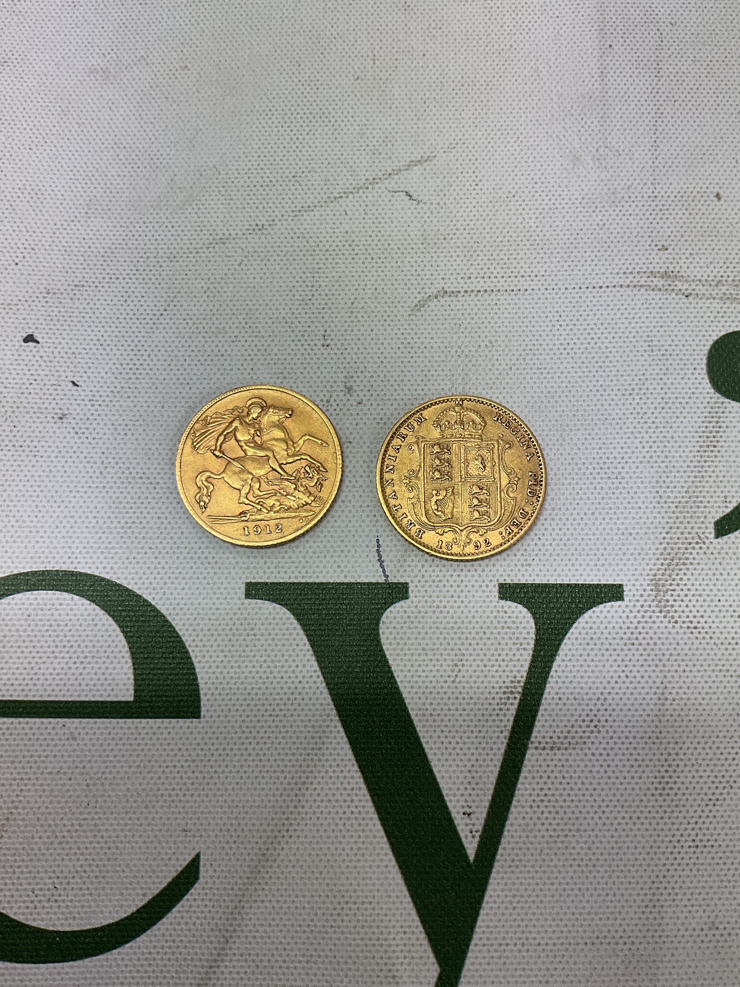 1892 shield back half sovereign and a 1912 London mint half sovereign