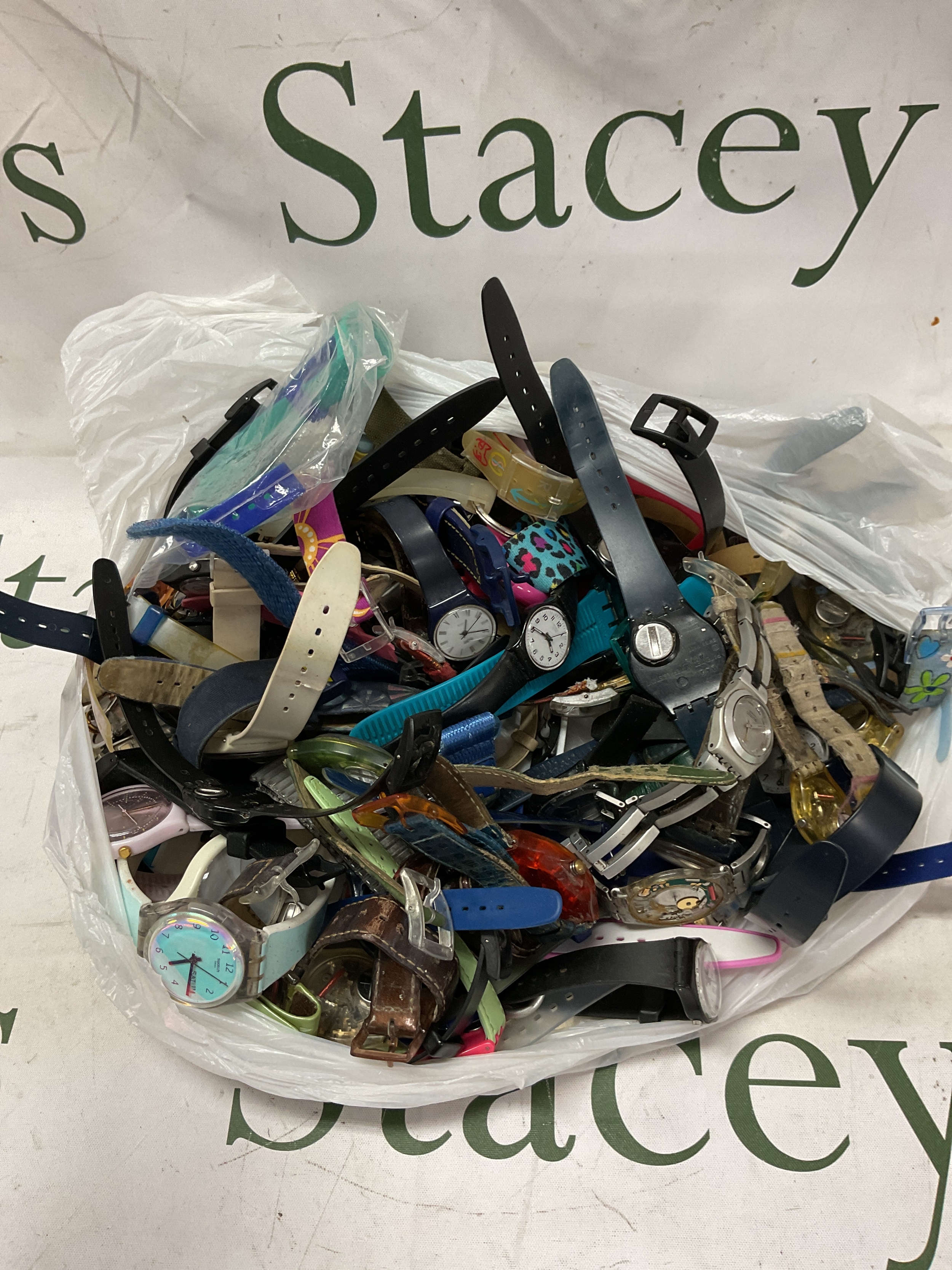 Bag of Swatch watch for spares/repair.