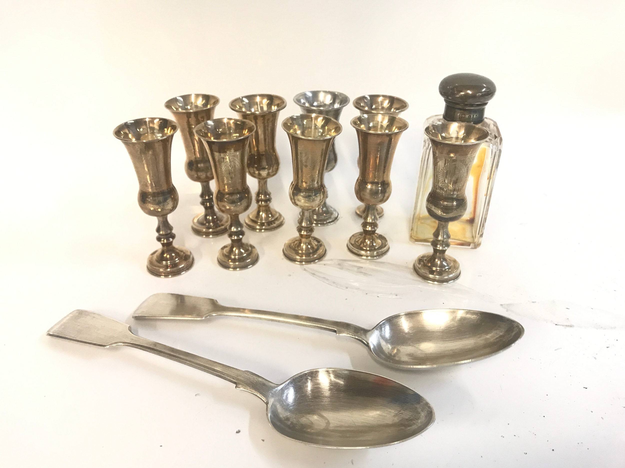 Silver cups, spoons, perfume bottle. 405g total weight excluding the glass 
