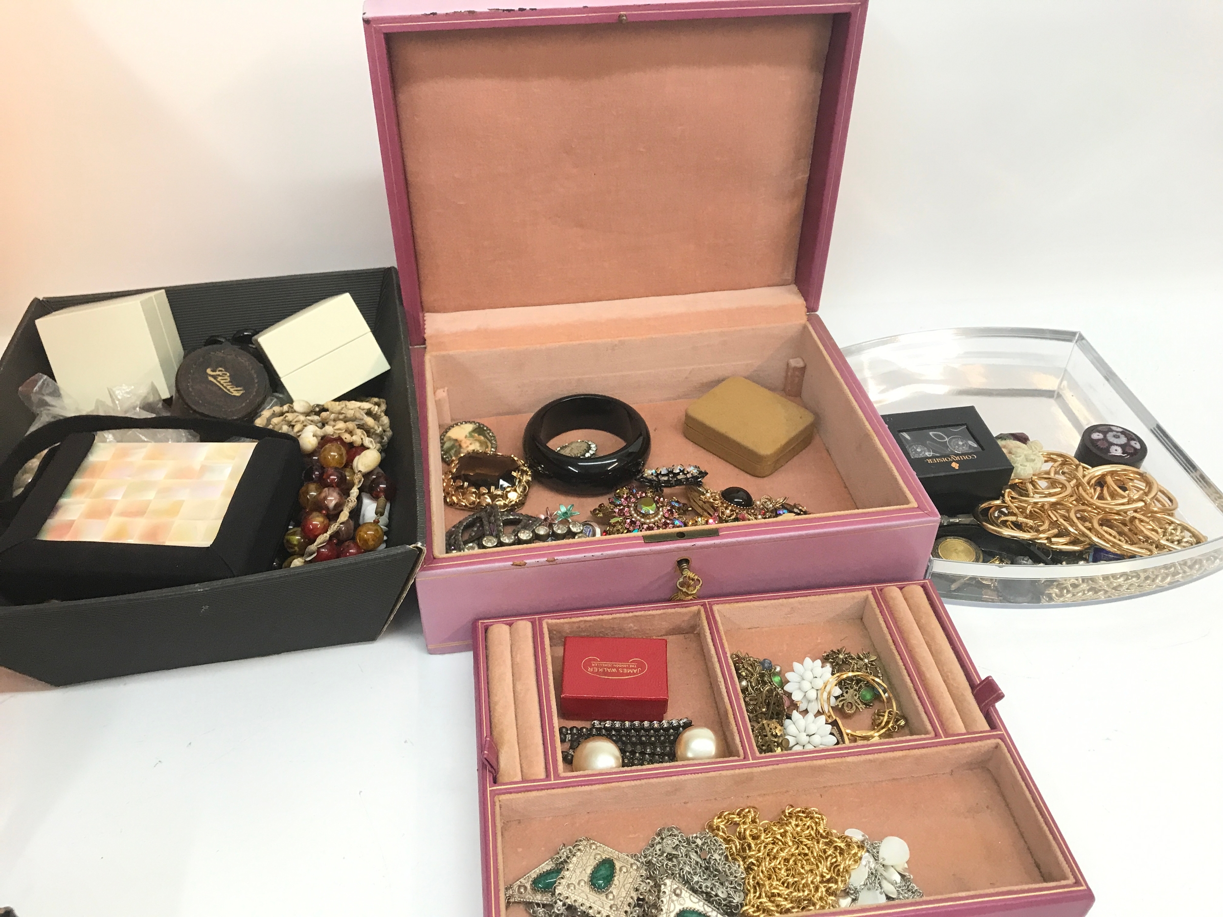 A Collection of various costume jewellery including necklaces, brooches, rings, a mother-of-pearl evening bag and gentleman's cufflinks and studs