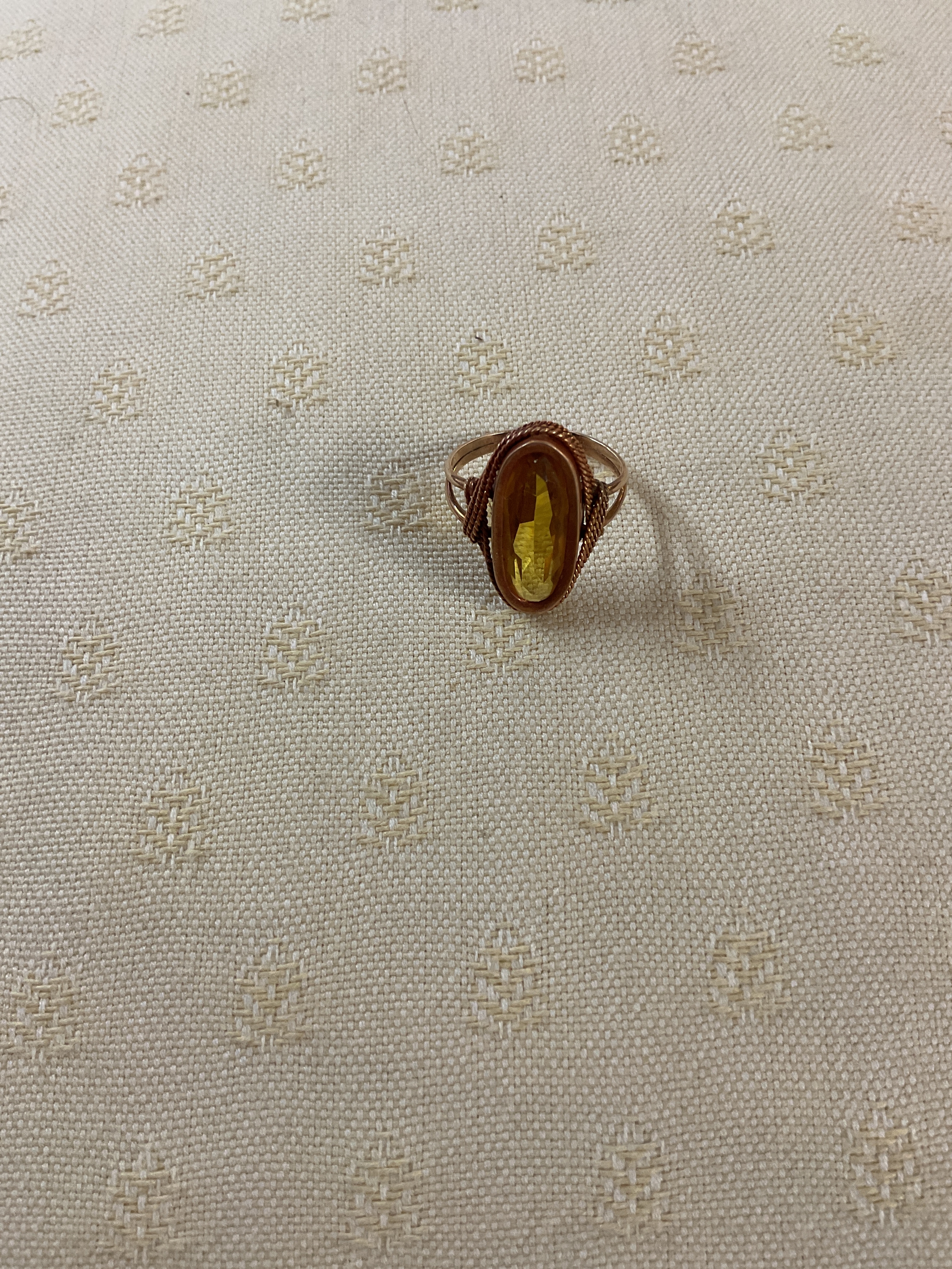 Yellow metal dress ring set with oval cut Citrine.weight 4.5 grams.