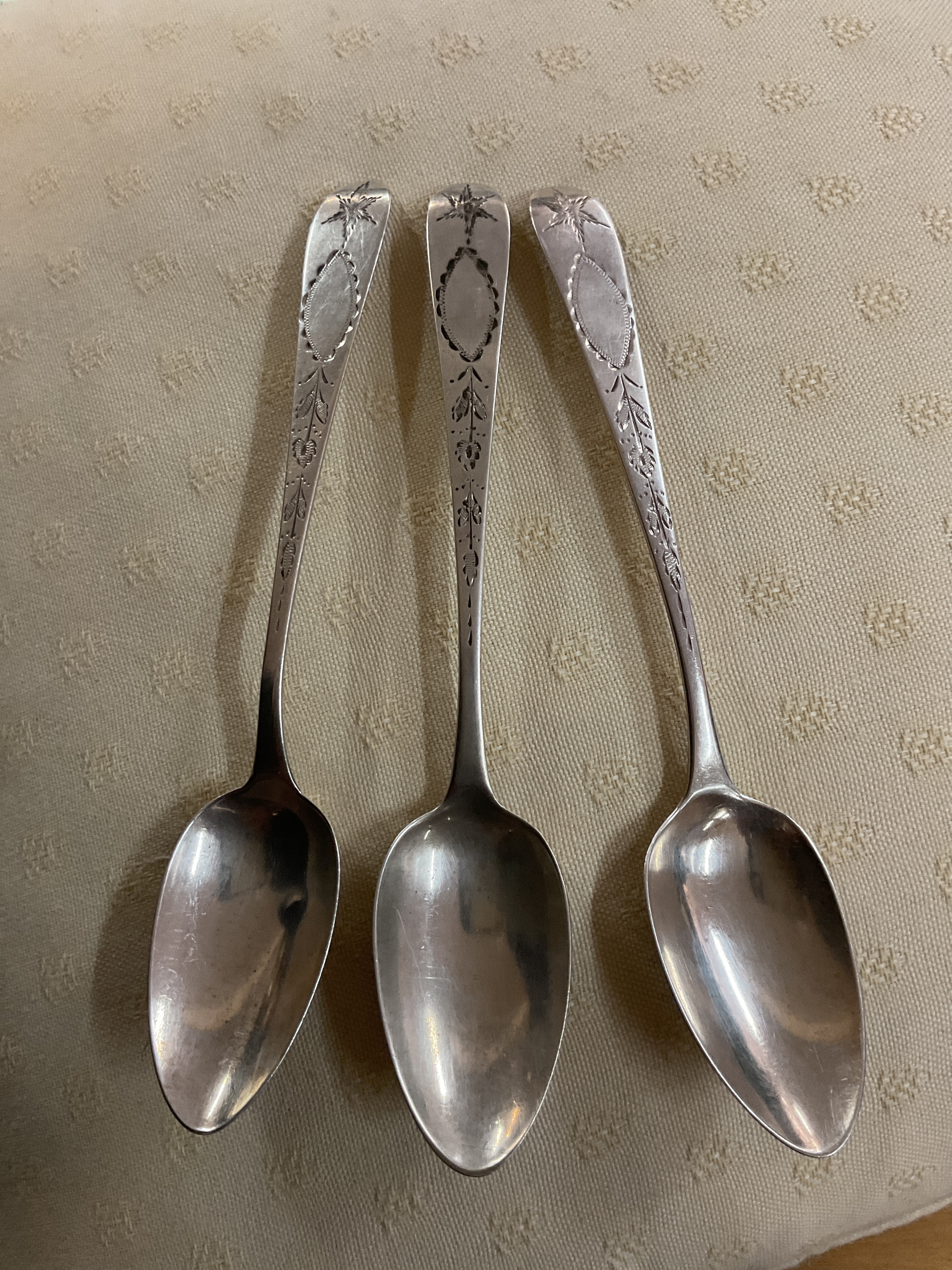 Irish Regency era spoons, two by John Power 1804 and one by John Pittar, all three with matching bright cut decoration of a star above floral cartouche. weight 65 grams.