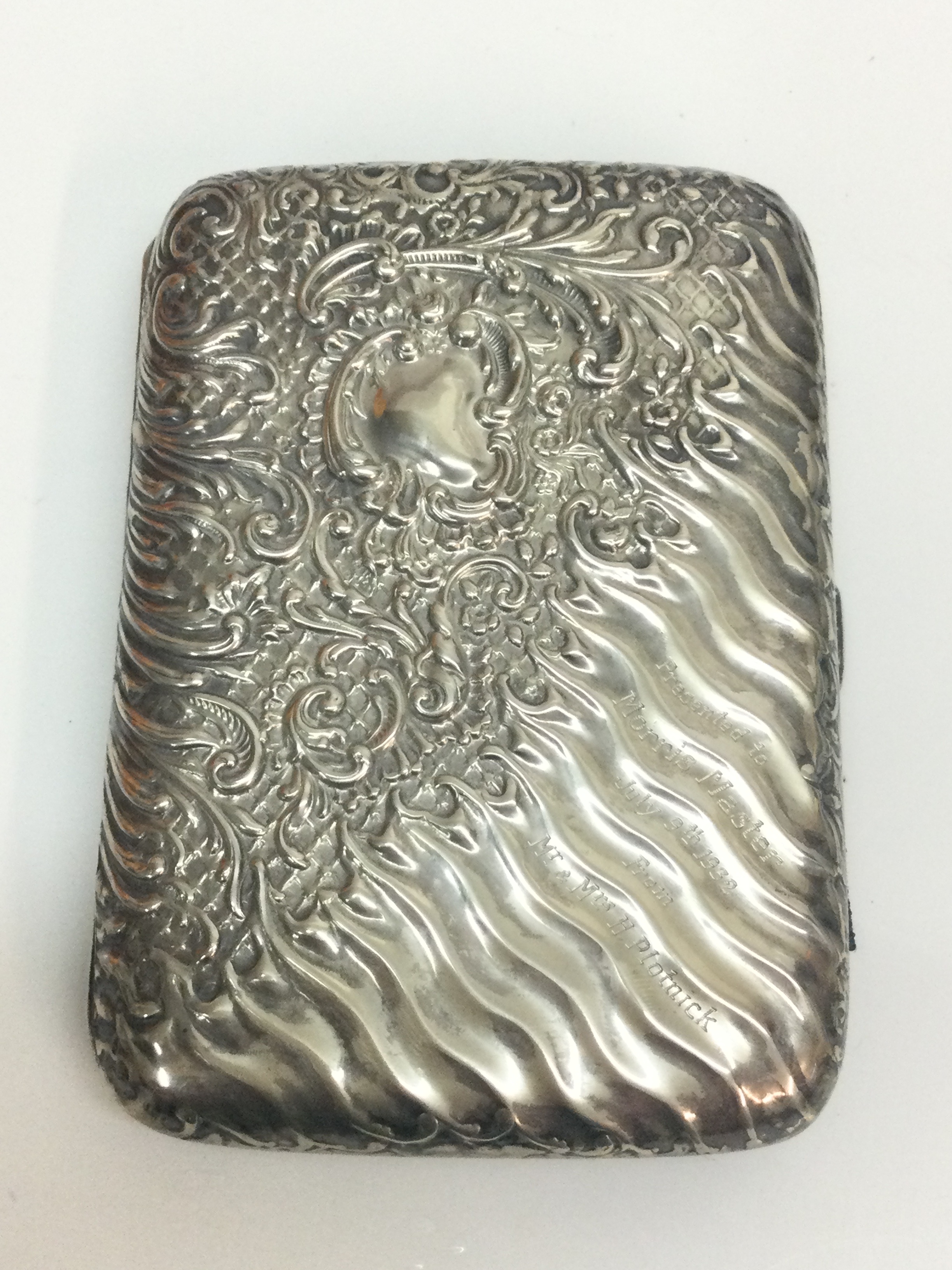 A fancy silver cigarette case, 160g total weight . 9x12cm