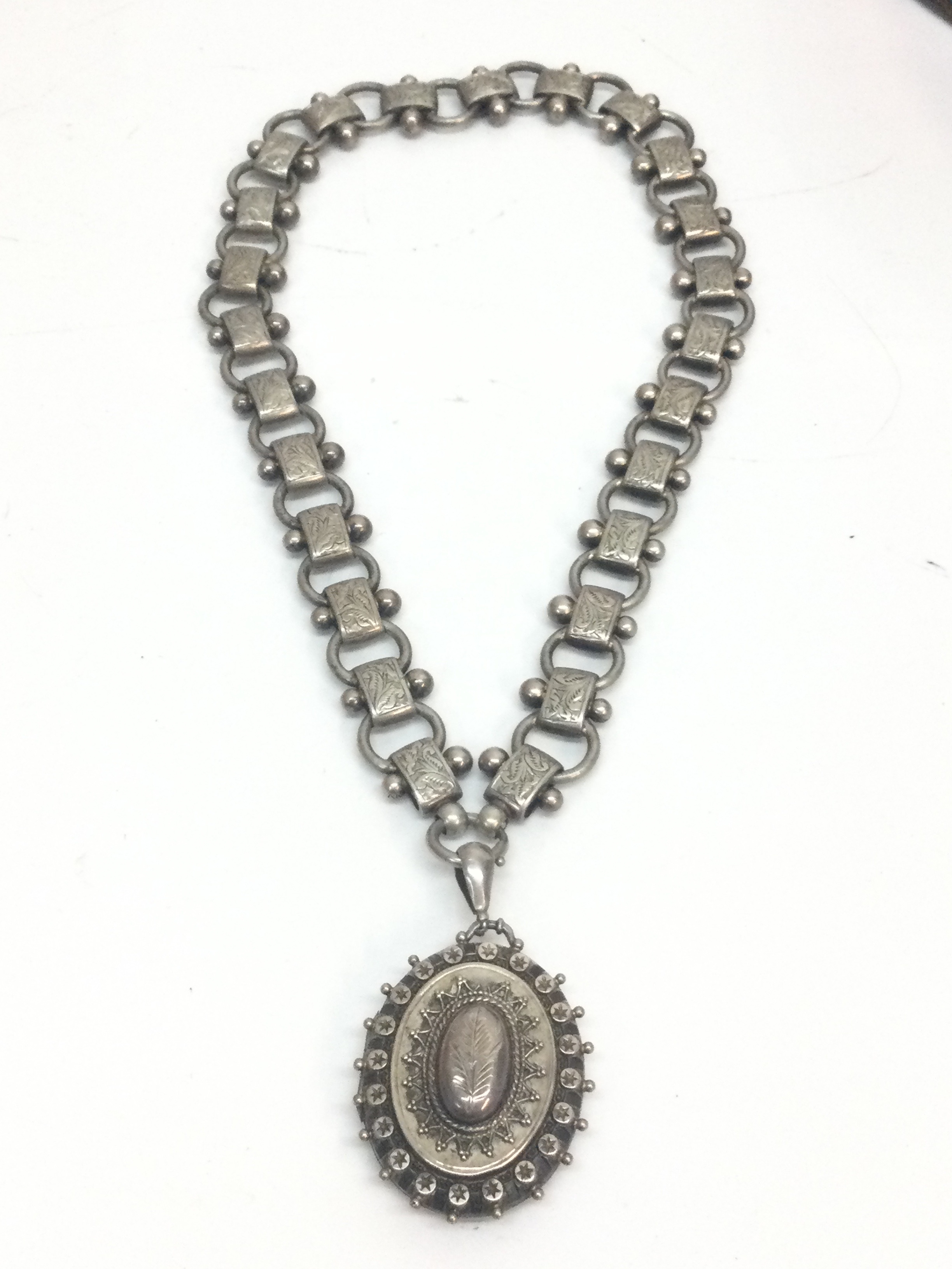 A Victorian silver locket And chain , 50g total weight, chain 20cm long 