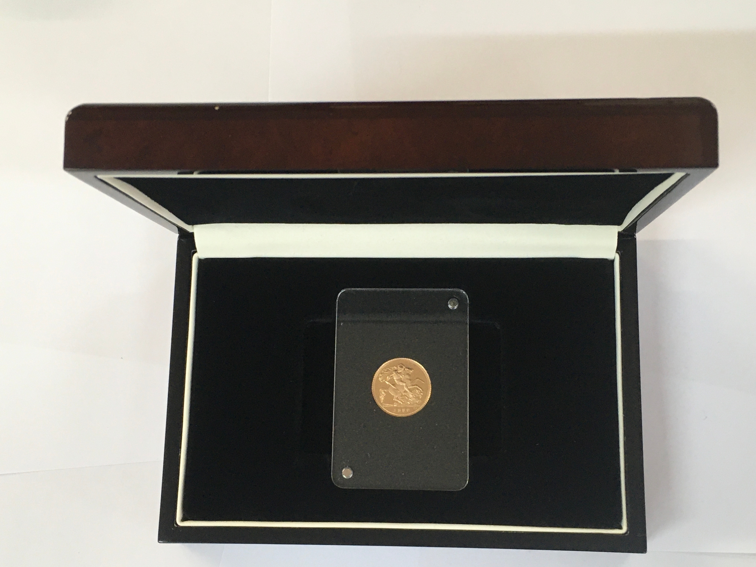 1980 Queen Elizabeth II half Soverign in slab. Includes case.