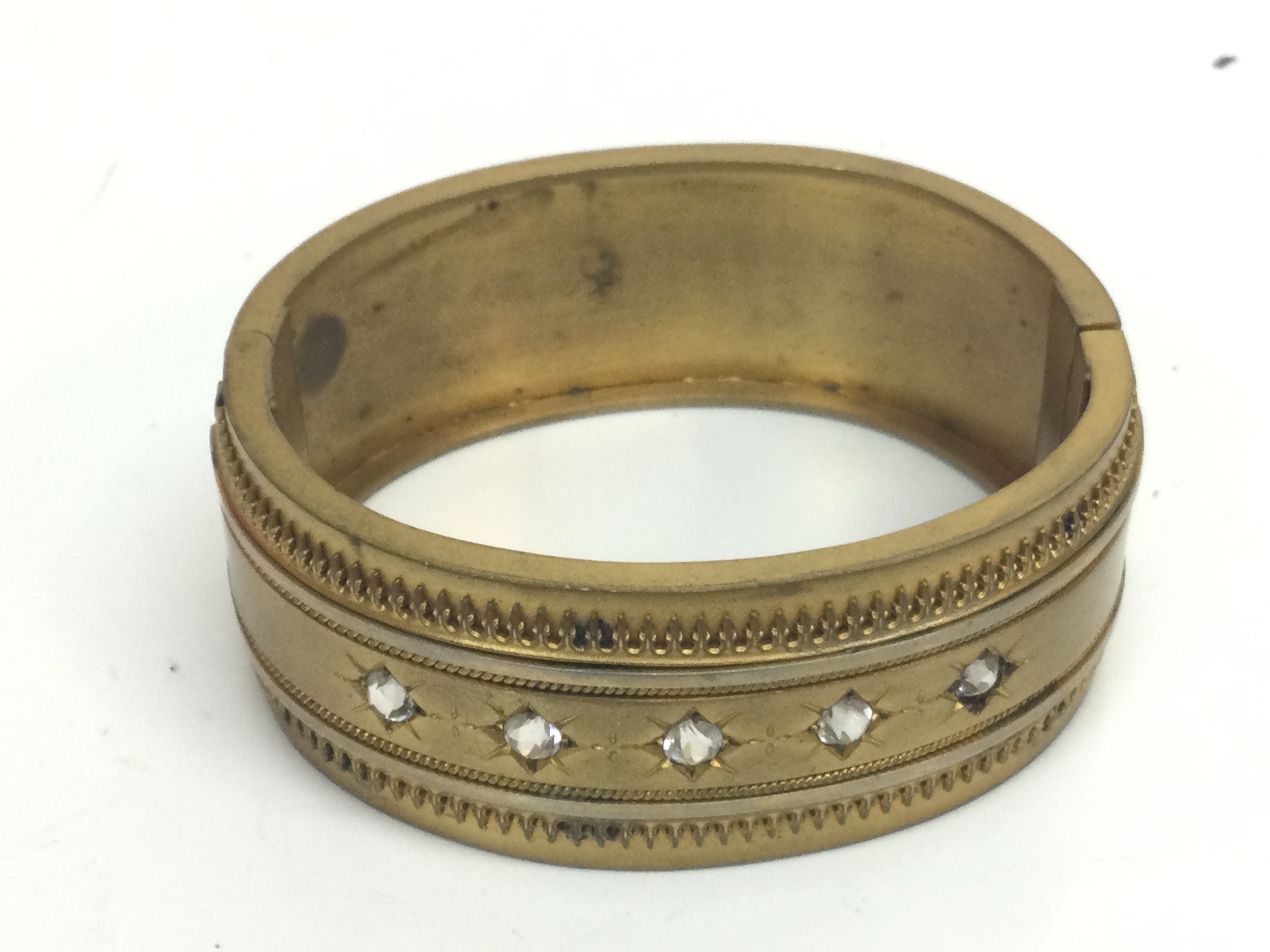 A Victorian gilded bangle , 7cm wide 