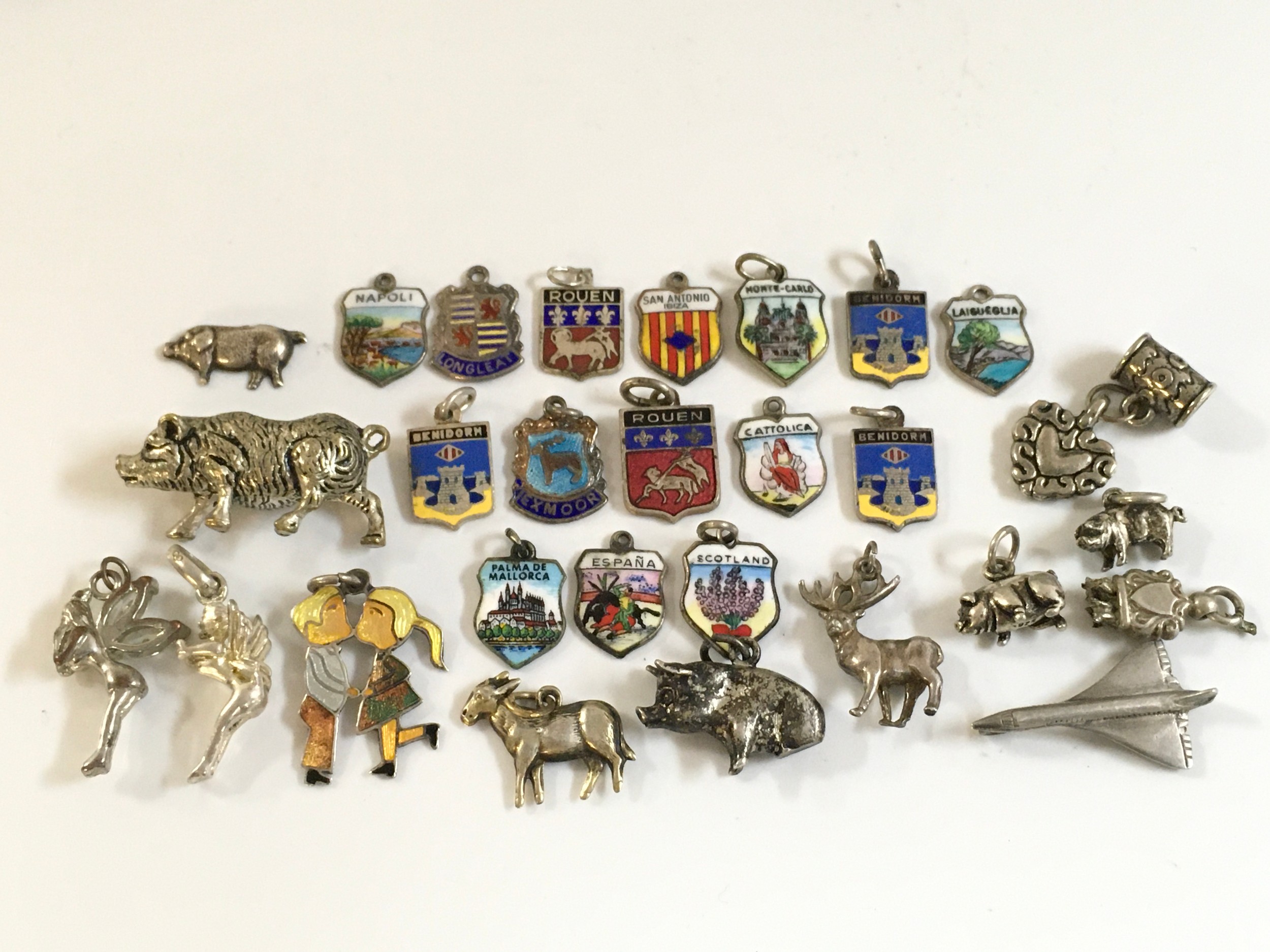 A collection of Silver charms, 64g total weight