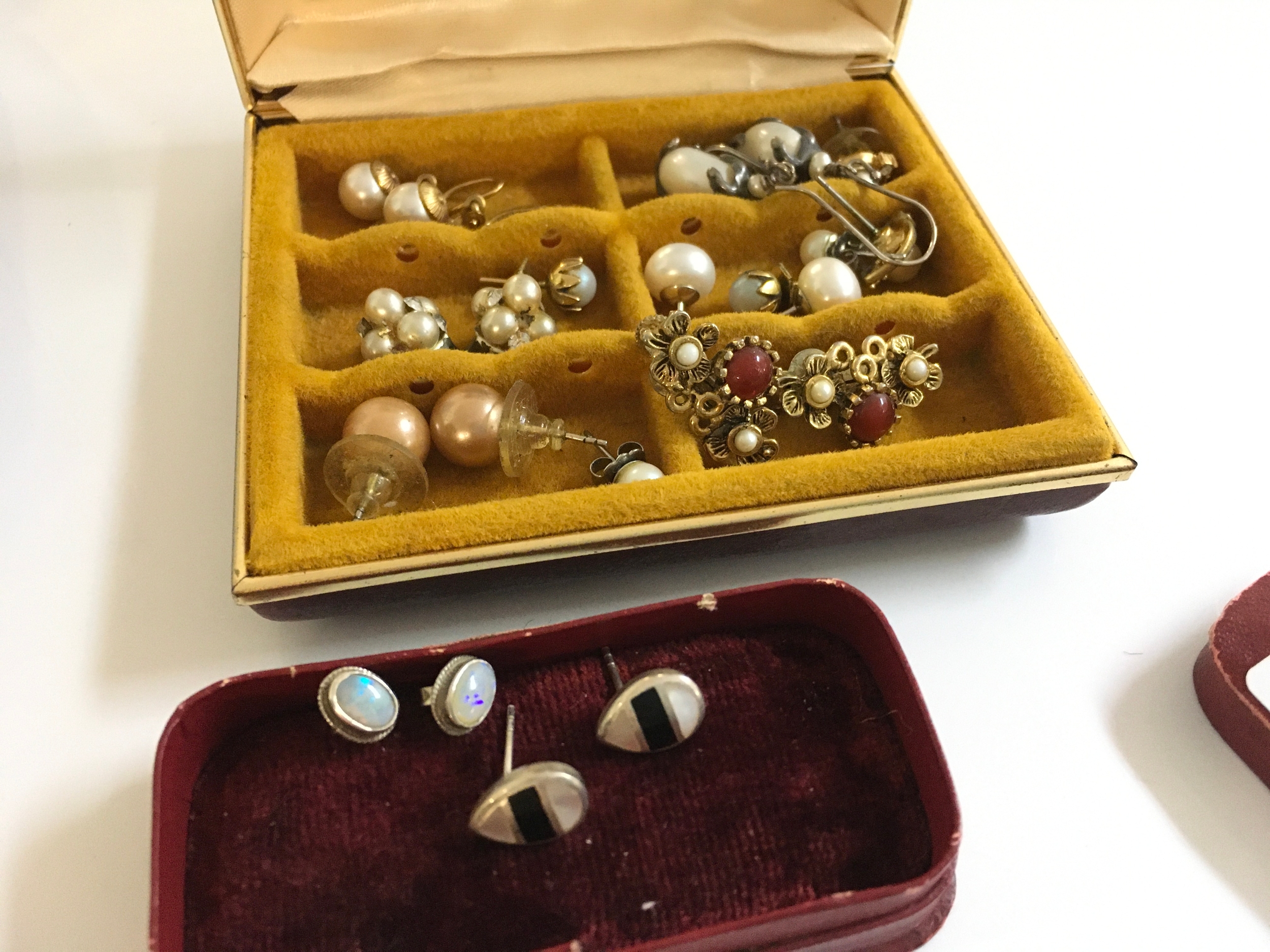 A collection of Earrings including pearl earrings, opal and mother of Pearl