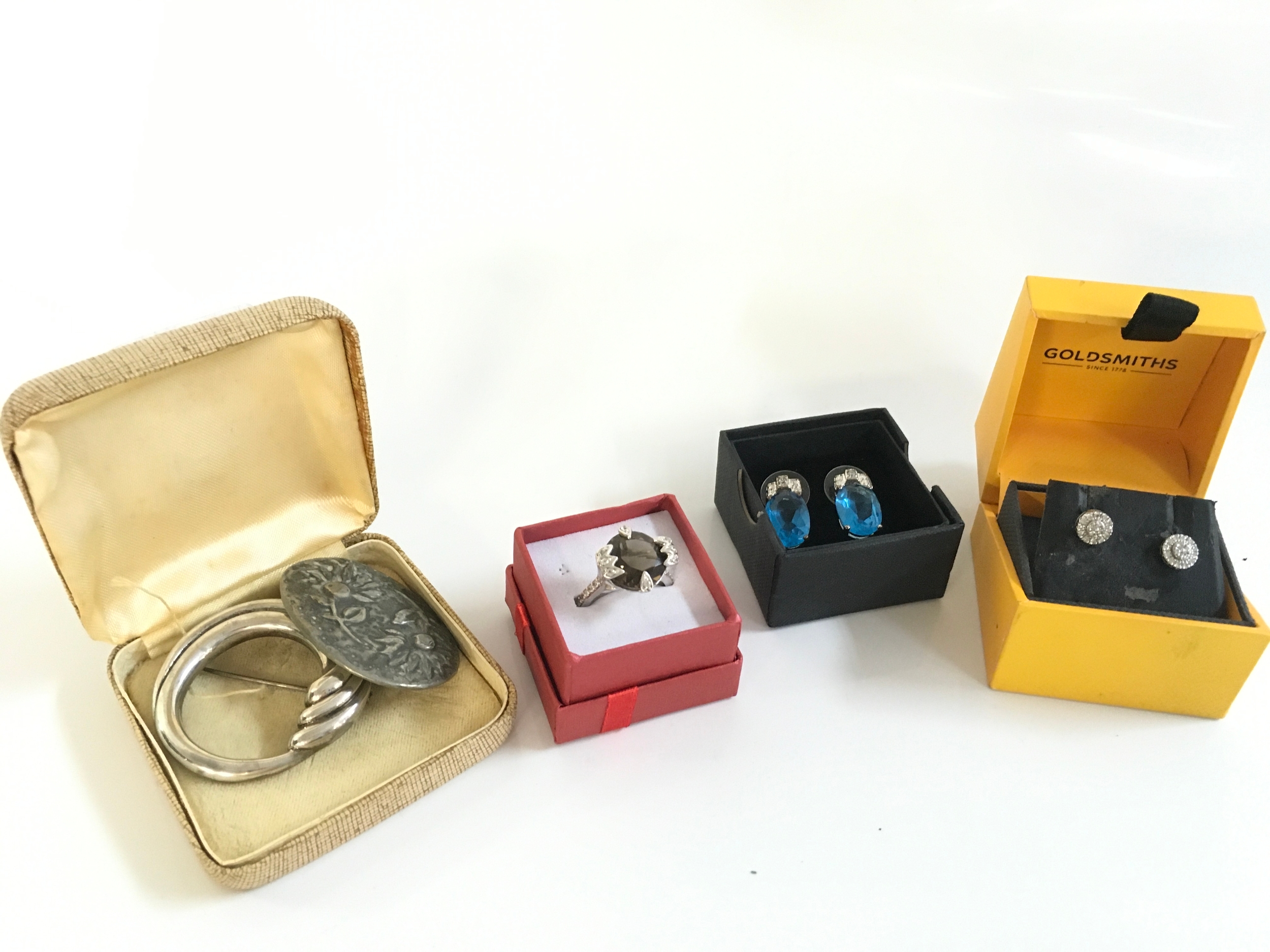 White gold diamond set earrings , a smoky quartz silver ring , silver brooch etc
