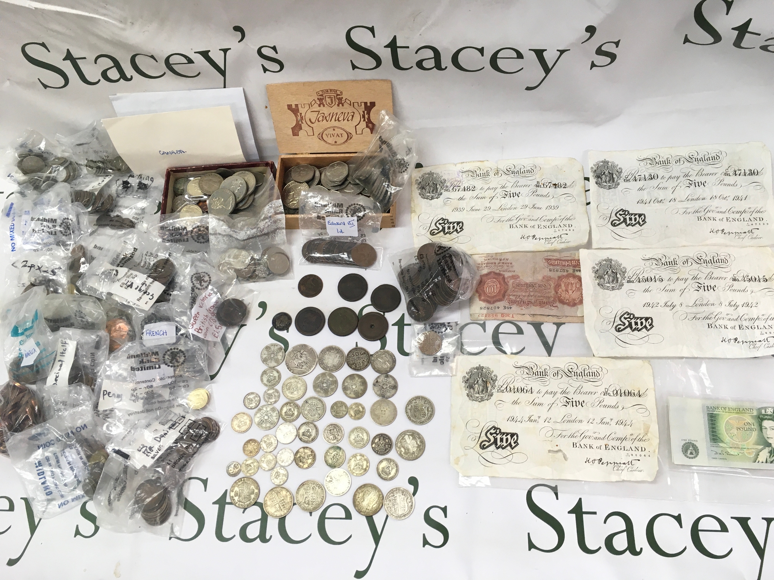 A collection of various circulated coins and bank notes including pre 1946 and pre 1920s coins and white £5 notes. approx 350g pre 1920/1946 coinage.