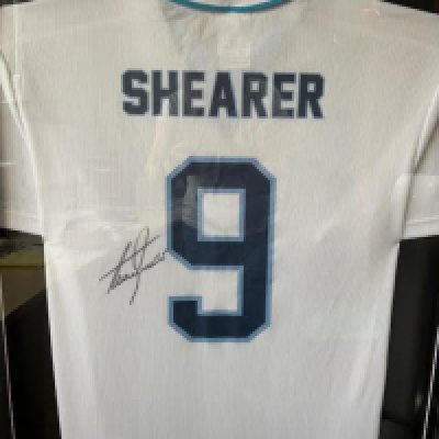 A framed and glazed signed Alan Shearer England Shirt <a href = https://www.the-saleroom.com/en-gb/auction-catalogues/staceys-auctioneers-and-valuers/catalogue-id-srsta10340/lot-438909ae-6edd-482b-8449-b1e800c65dcd>Click Here to bid</a>