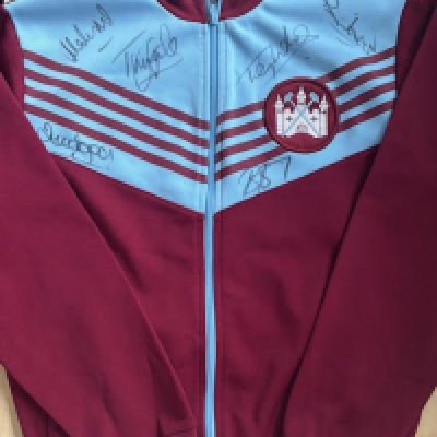 A retro 1978 signed West Ham Tracksuit top including signatures Tony Gale, Tony Cottee,  Mark Ward, Brian Dear, Kenny Brown , and Bertie Brayley. <a href = https://www.the-saleroom.com/en-gb/auction-catalogues/staceys-auctioneers-and-valuers/catalogue-id-srsta10340/lot-7e9f90c9-df81-49ac-bff4-b1e800c65ee8>Click Here To Bid</a>