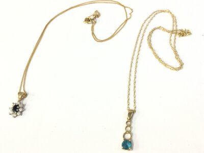 Two gold necklaces with pendants. 3.7g