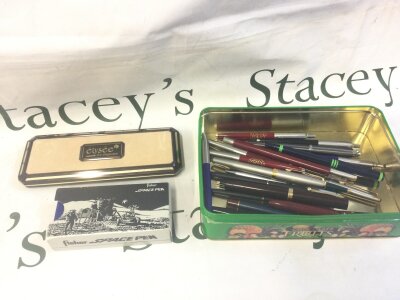 A mixed collection of pens including a boxed fisher space pen