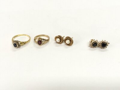 An 18ct gold ring 2.61g set with stone and a 9ct ring 1.45g along with two pairs of earrings 3.96g