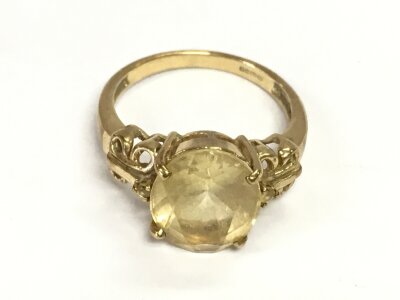 A 9ct gold ring set with white quartz. Size N 1/2 and 3.66g