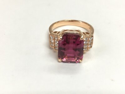An 18ct rose gold pink tourmaline and diamond ring. Size N with cert.
