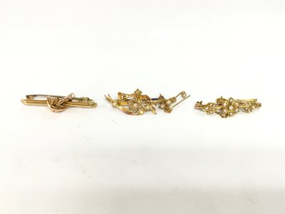 Three gold bar brooches two marked 15ct which are 6.12g and the other 3.20g