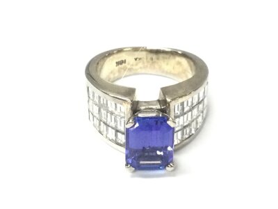 An 18ct white gold tanzanite and diamond dress ring. Octagonal cut AAA quality 2.93ct tanzanite. Diamonds 2.08ct. Made by Baroka Creations of New York. 14.98g weight and size L 1/2.