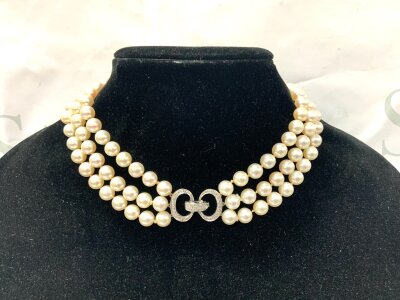 A raw polished double strand turquoise bead necklace with a heavy 18ct gold clasp. 55cm, 9mm pearls.