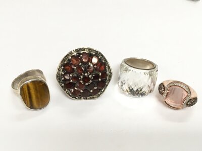 Three large silver rings and a Swarovski example (4). NO RESERVE