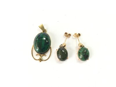 A 14ct gold stone set pendant and a pair of stone set earrings