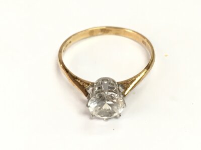 A 9ct gold solitaire ring set with cut white stone. Size T and 2.10g