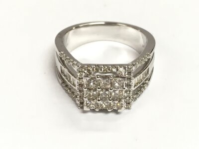 9ct white gold baguette cut and diamonds. Square cluster ring with trident style shoulders. Diamonds approximately 1.10ct. Size N
