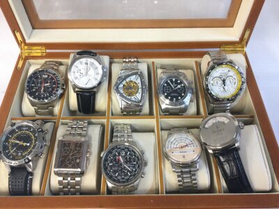 A collection of 10 watches and copy watches including Citizen, Stauer etc in a maple style watch box