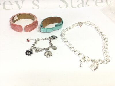 Four pieces of “guess” jewellery