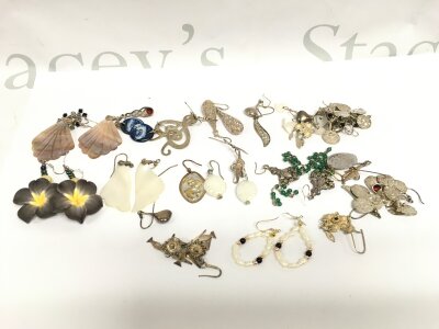 20 pairs of large silver earrings