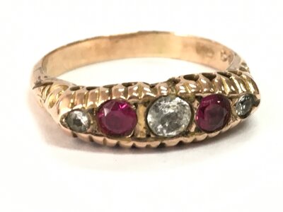 A 9ct gold ruby ring, size O/P. 2g